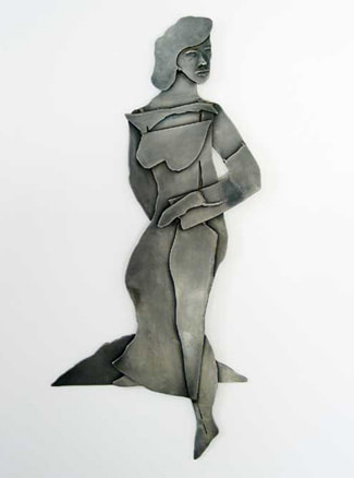 A steel wall scultpure of a vertical woman. Given to the Women's Crisis Center in Newburyport, Ma for a fund raiser. 